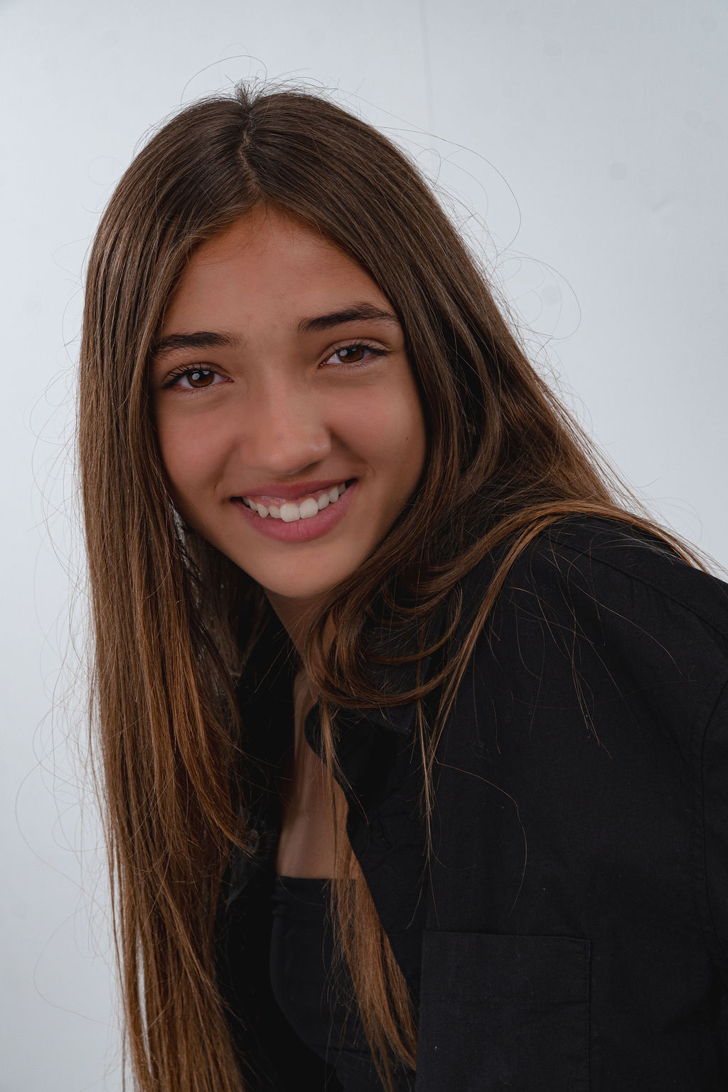 Thérèse smiling in a dark jacket